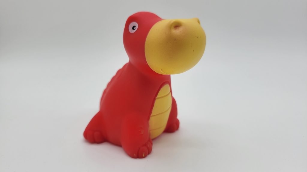 sealed red dinosaur bath toy