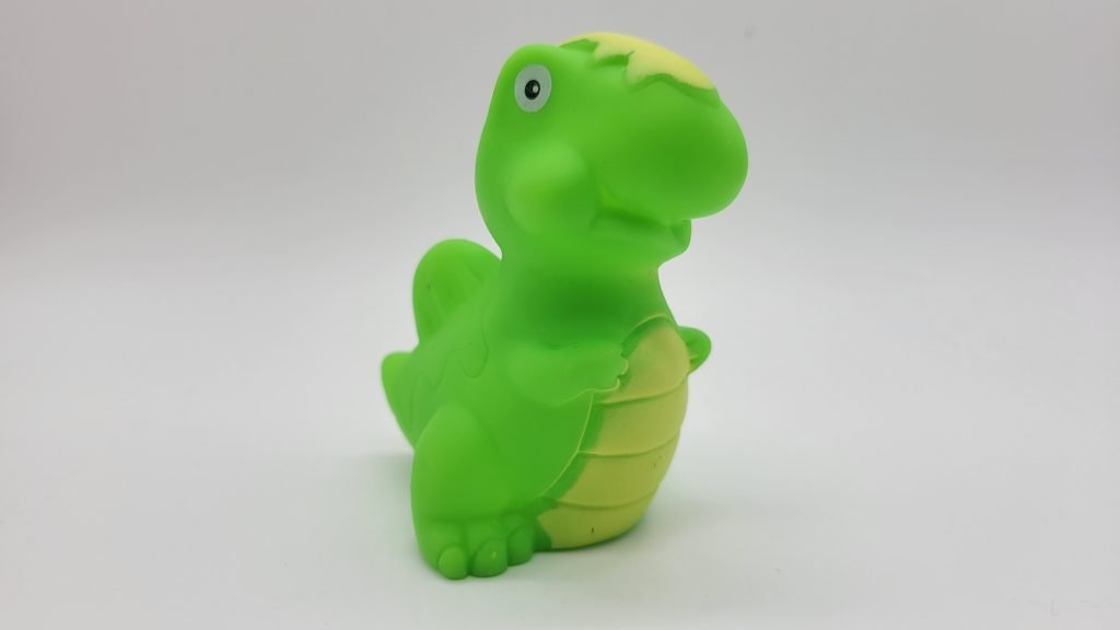 sealed green dinosaur bath toy